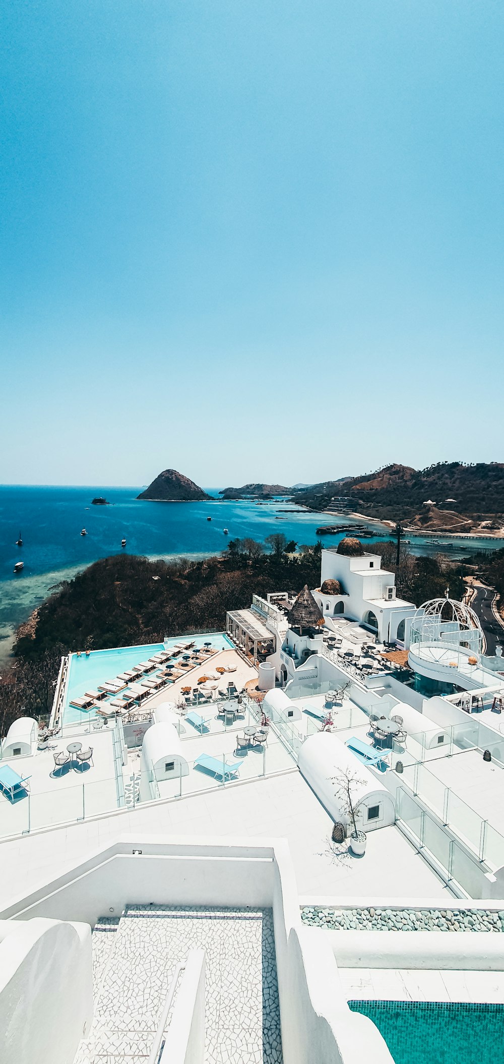 an aerial view of a resort with a swimming pool