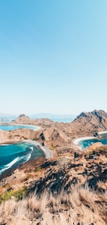 a scenic view of a beach and a body of water