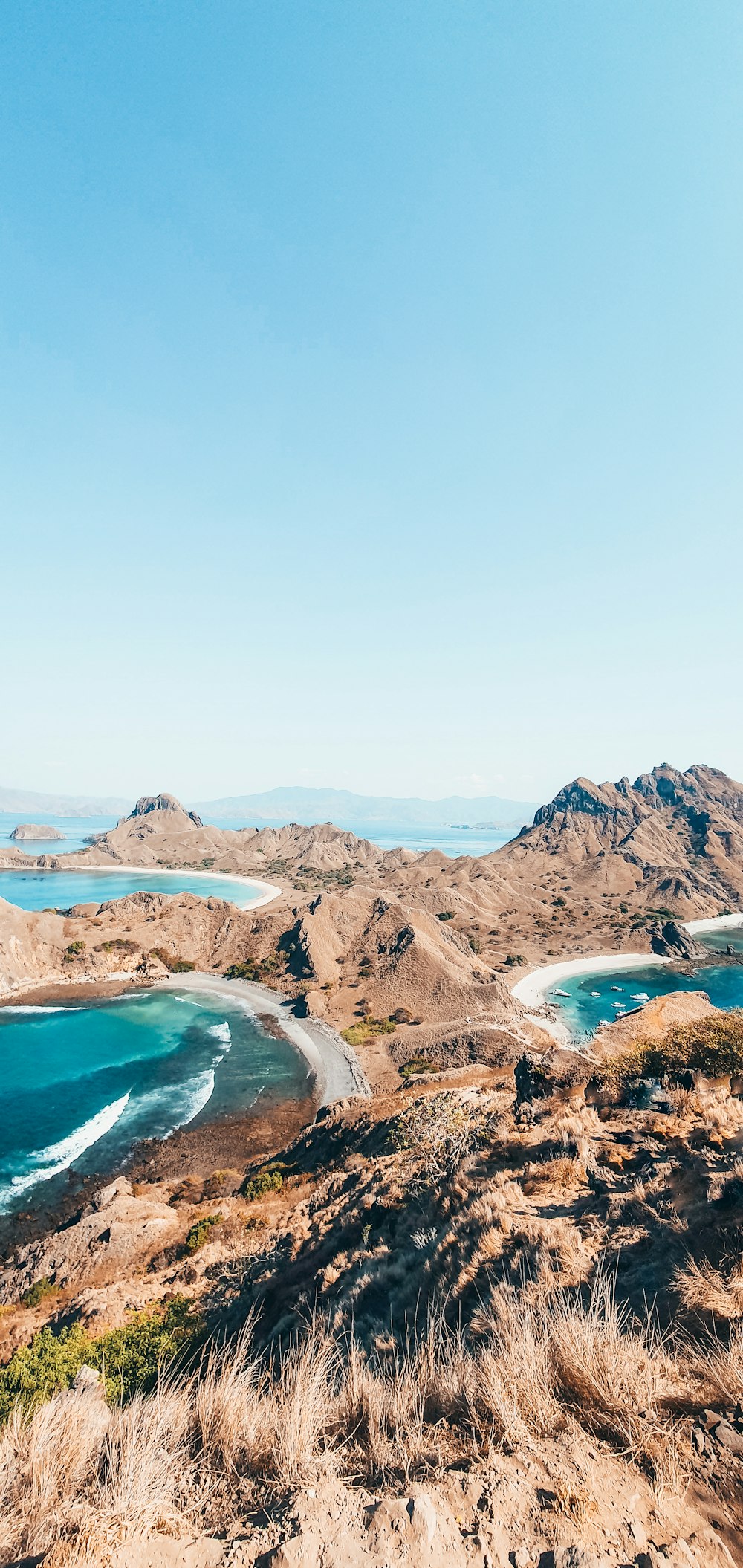 a scenic view of a beach and a body of water