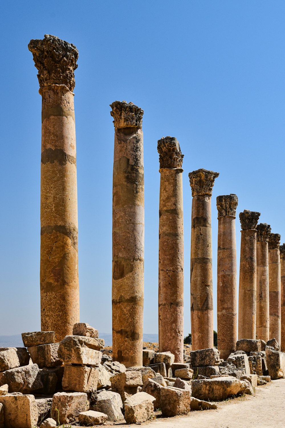 a row of stone pillars sitting next to each other