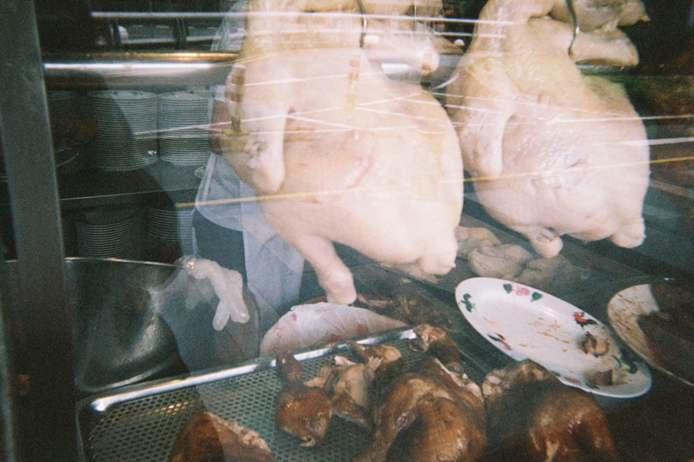 a bunch of chickens that are on a grill