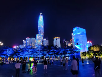A nighttime cityscape with glowing blue lights reflecting the energy of digital innovation.