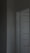 Close-up of a modern interior door installation in a bright, renovated kitchen space.
