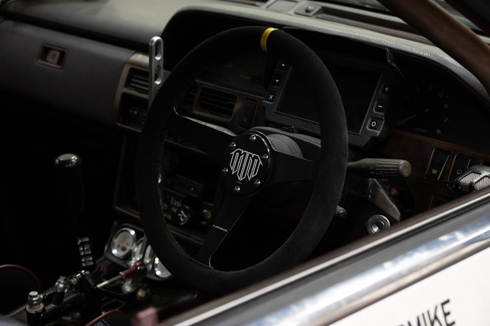 a steering wheel and dashboard of a car