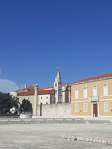 A calm European town under a clear sky, symbolizing precise weather tracking.