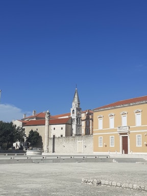 A calm European town under a clear sky, symbolizing precise weather tracking.
