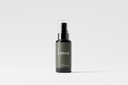 A sleek bottle with a minimalist design, featuring a dark green label and the brand name 'kanva' in white text. The bottle has a black pump dispenser and a transparent cap, set against a light gray background.