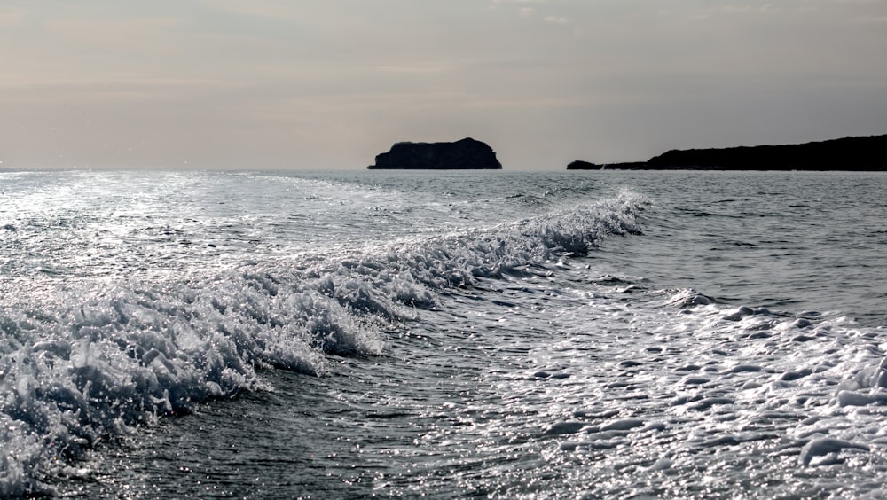 a wave is coming towards the shore of the ocean