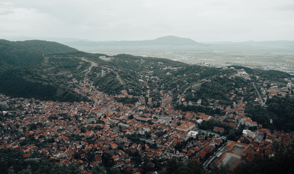 an aerial view of a city in the mountains