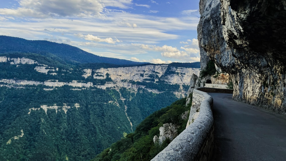 a scenic view of a mountain and a road