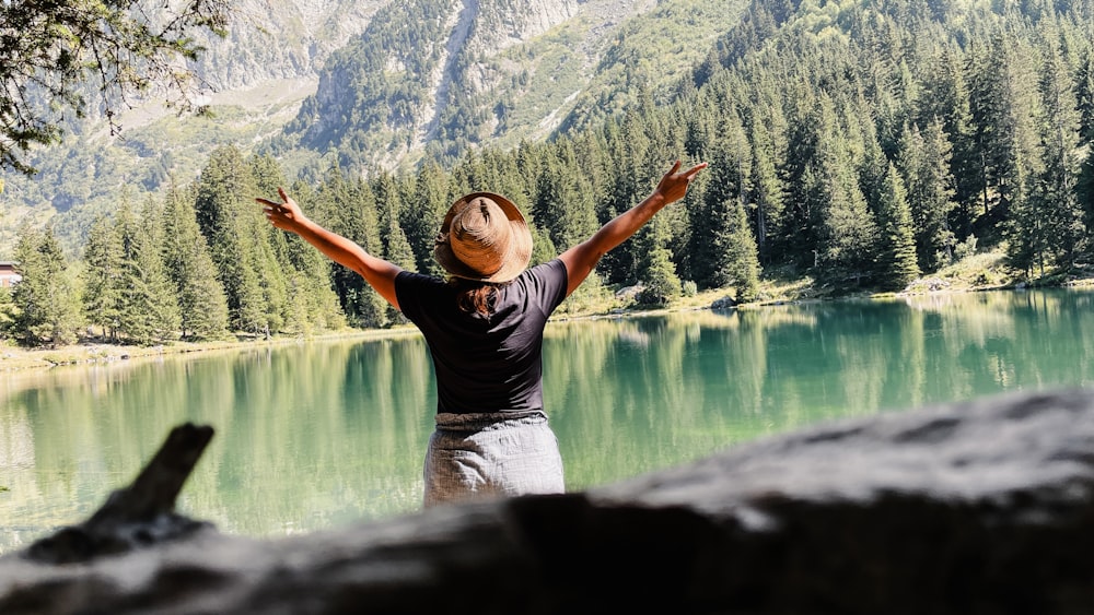 a person standing in front of a body of water