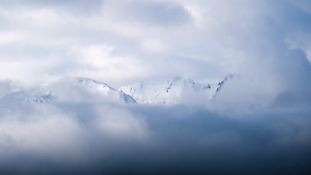 a view of a snow covered mountain from a plane