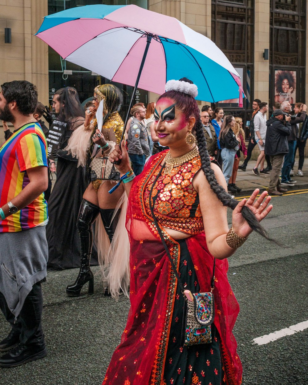 a woman in a costume holding an umbrella