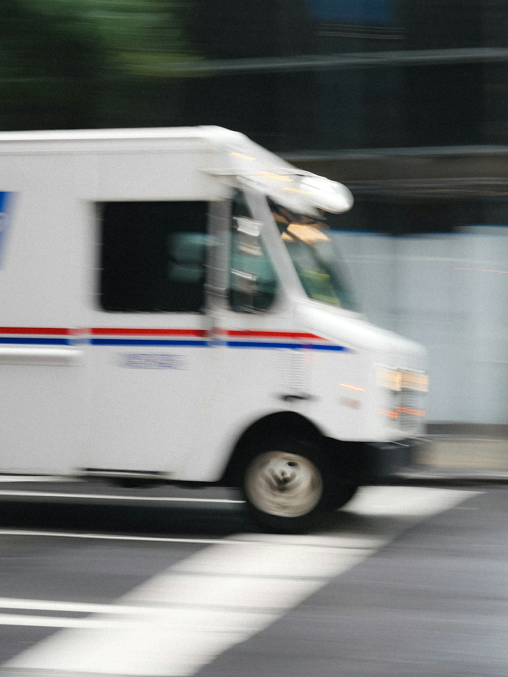 a delivery truck driving down a city street