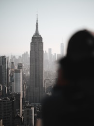 a person standing in front of a city skyline