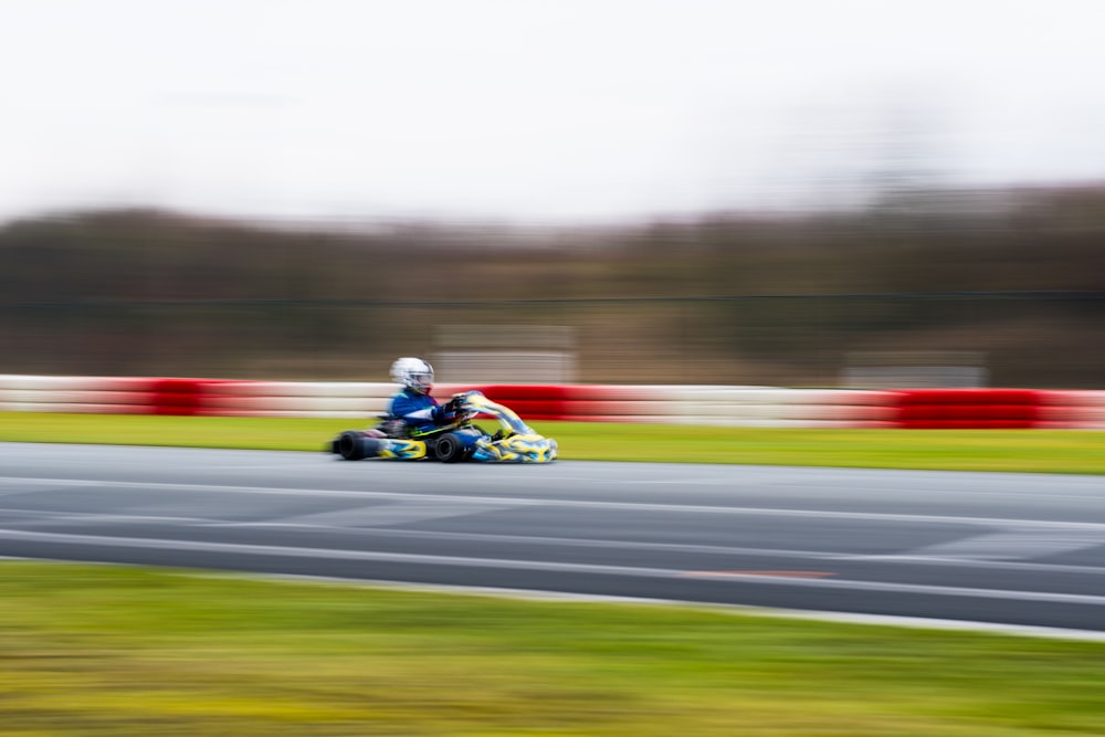 a person riding a motorcycle on a race track