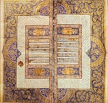 An ancient Mughal manuscript page displaying calligraphy and miniature paintings.