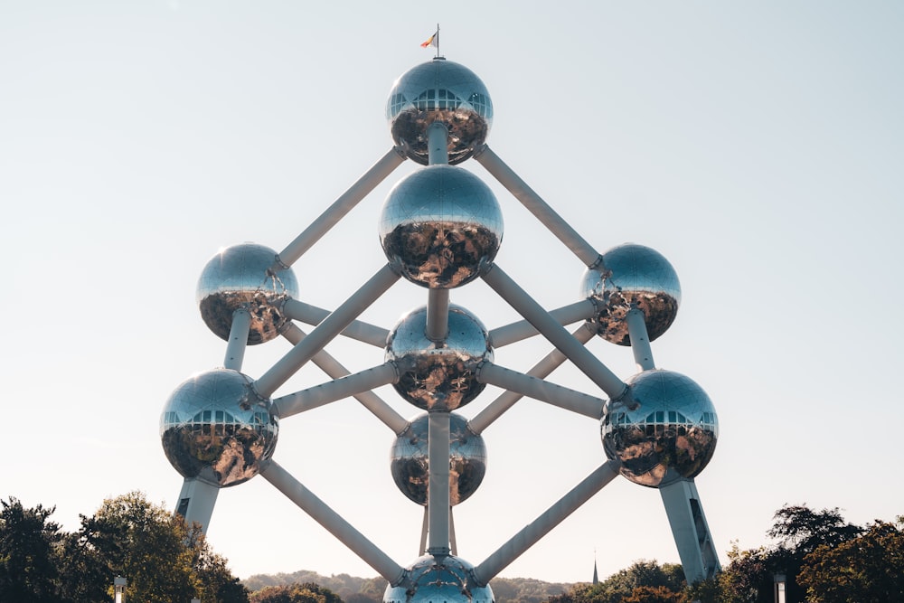 a large metal structure with a bunch of balls on top of it