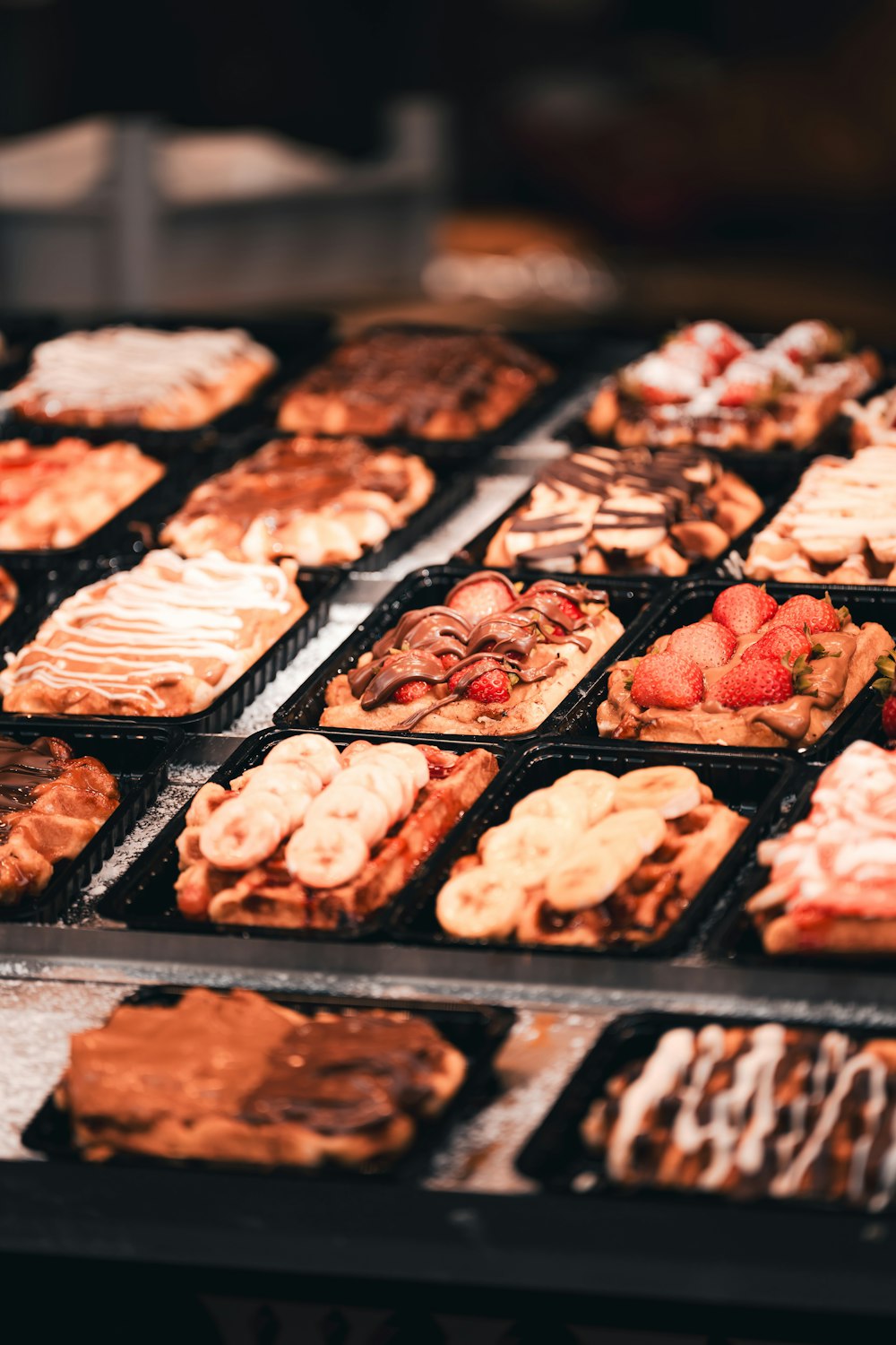 a display case filled with lots of different types of pastries