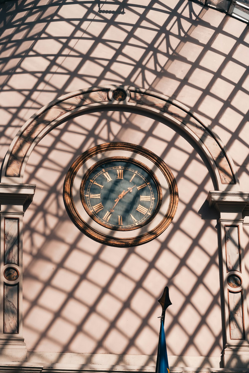 a large clock mounted to the side of a building