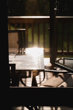 Natural light illuminating a resin table drying on a workbench