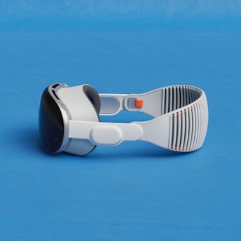 a pair of google glasses on a blue surface