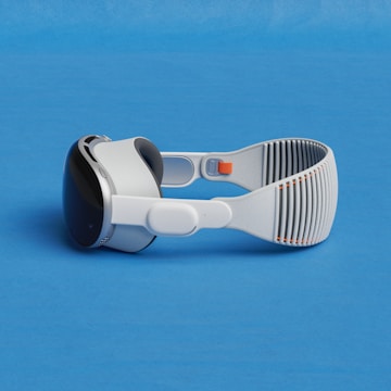 a pair of google glasses on a blue surface