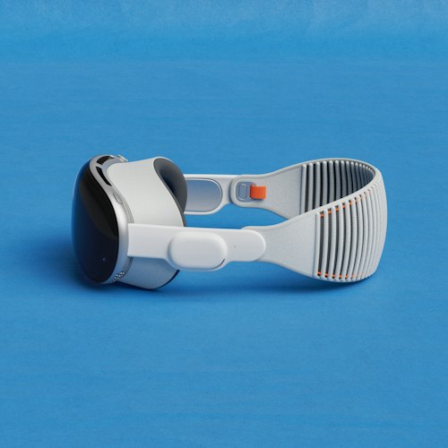 A pair of AR glasses resting on a museum brochure with a gallery in the background
