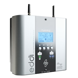 A sleek, rectangular electronic device with an interface labeled 'myenergi.' It features an LCD screen displaying various energy metrics, such as power output and heating status. The device has multiple buttons for control, two antenna-like extensions on top, and brand names like 'eddi' and 'varisine technology' printed on the front. The finish is a combination of matte and glossy surfaces in neutral colors.