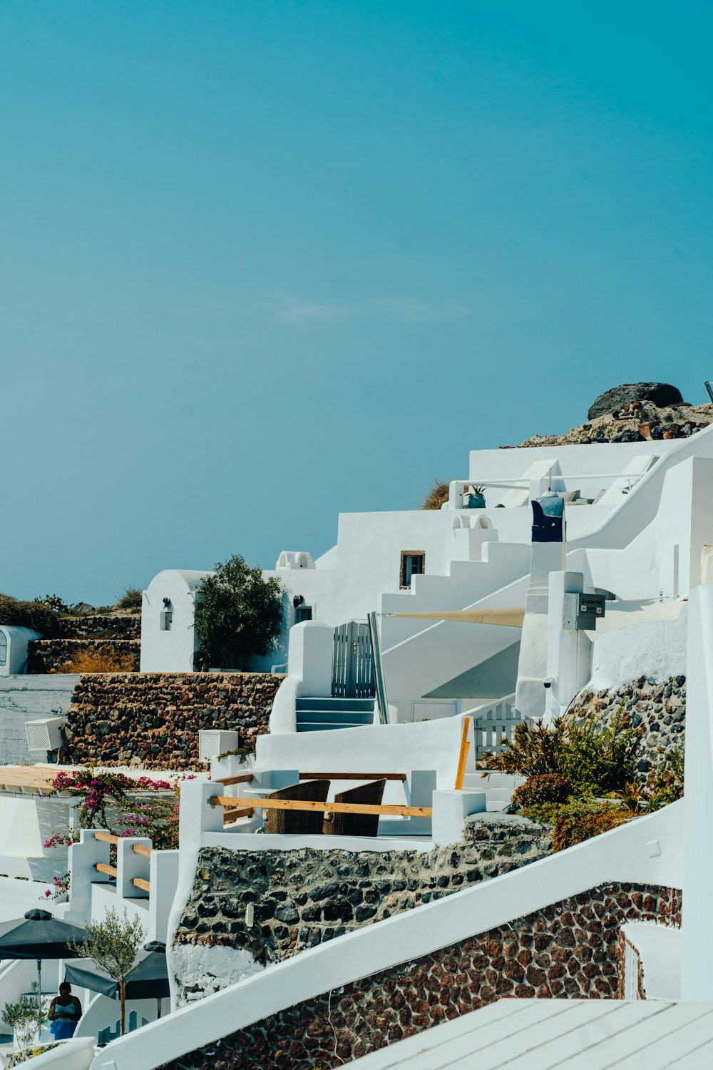 a view of a white building with a blue sky in the background