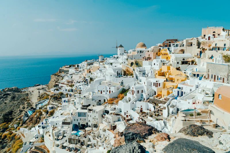 Aerial view of Santorini's caldera cliffs and Aegean sea
