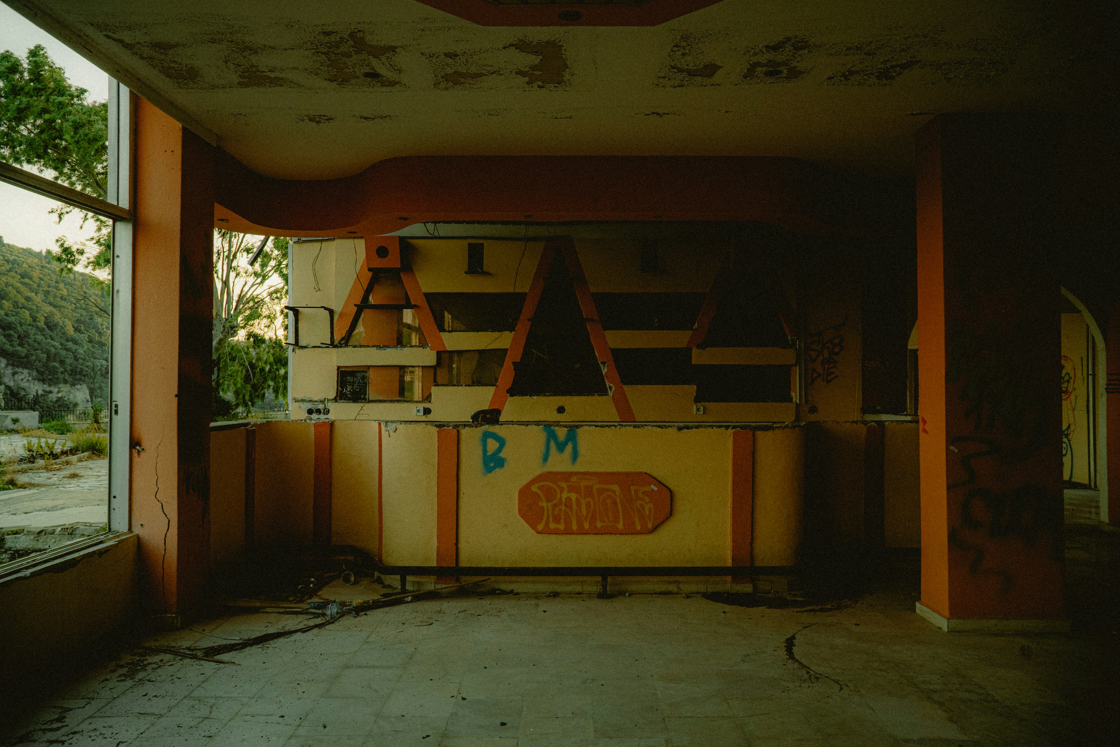 an empty room with a sign on the wall