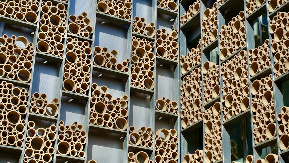 a building made out of wooden sticks and tubes