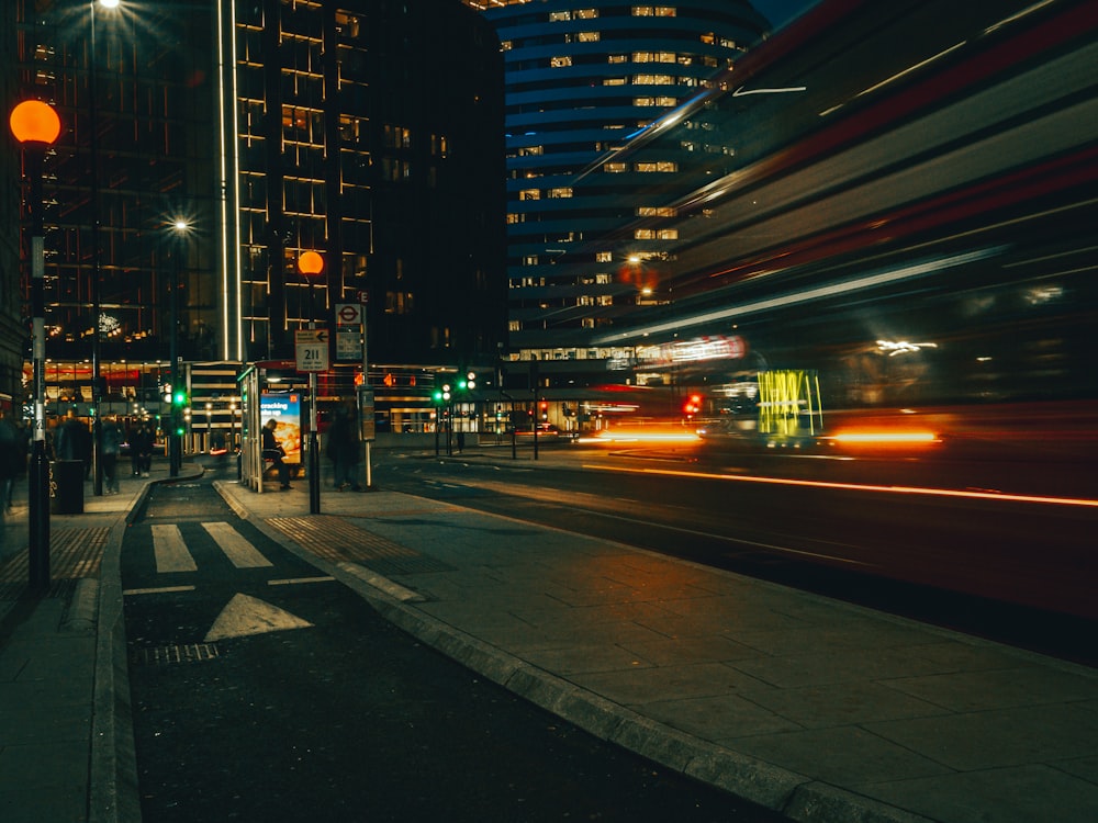 a blurry photo of a city street at night