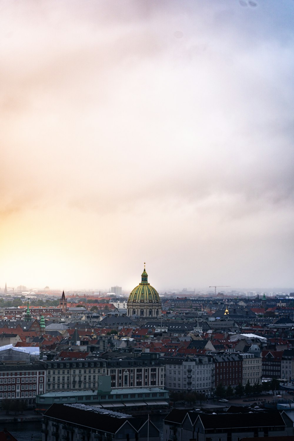 a view of a city with a dome in the middle