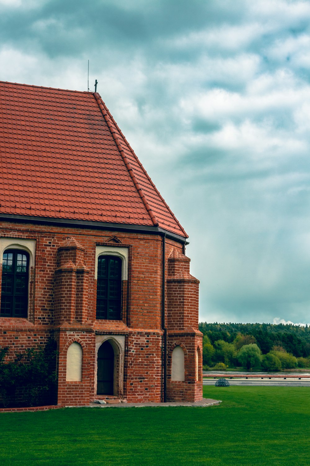 a large brick building with a red tiled roof