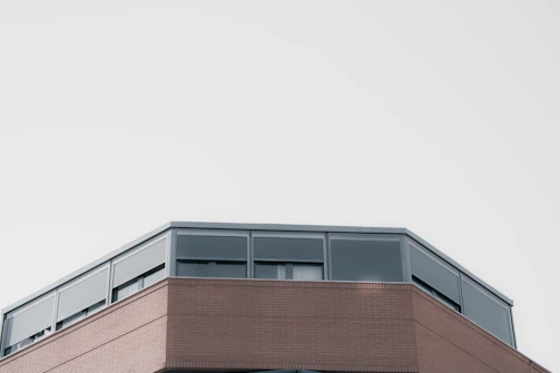 Commercial building with a flat roof and metal siding, freshly renovated.