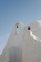 Close-up of Cycladic minimal design details in Nerida’s architecture with warm, sandy hues.