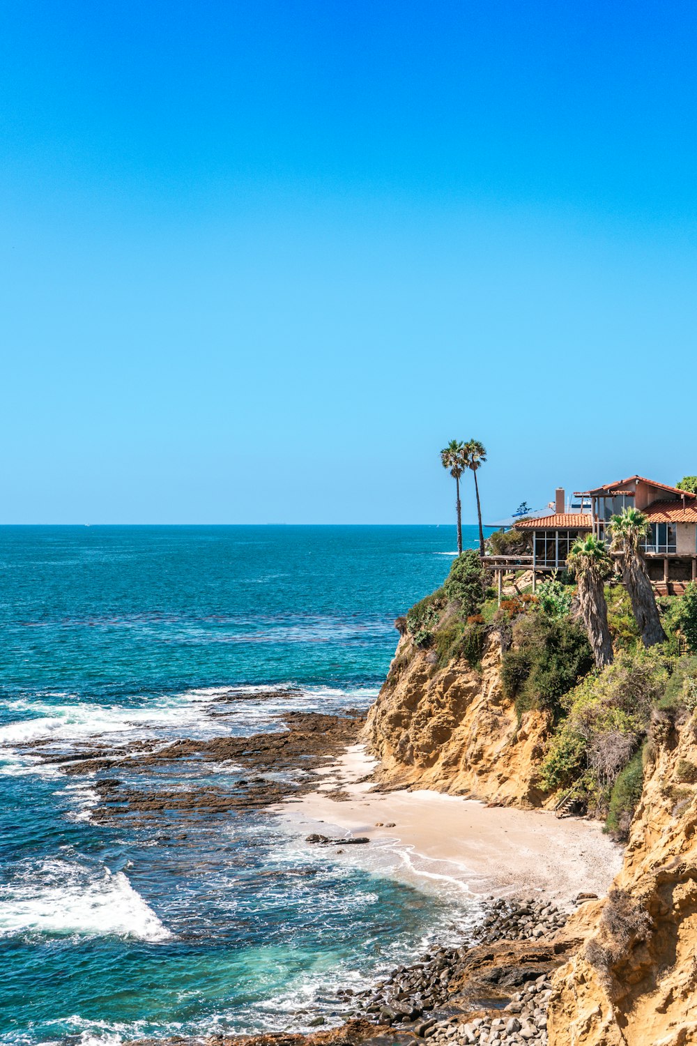 a house on a cliff overlooking the ocean