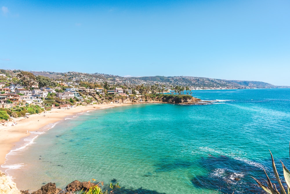 a view of a beach with clear blue water