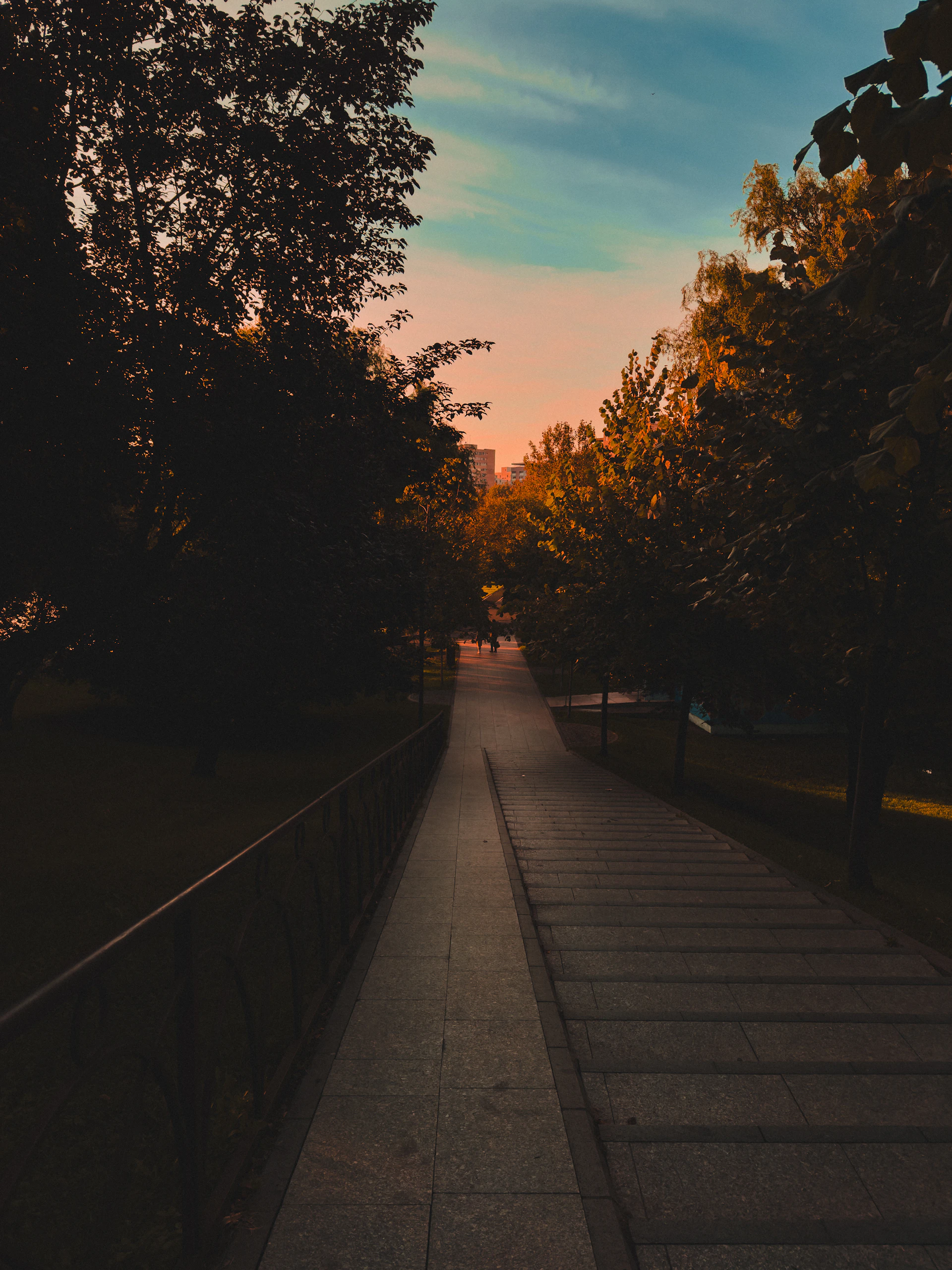 woman wearing yellow long-sleeved dress under white clouds and blue sky during daytime