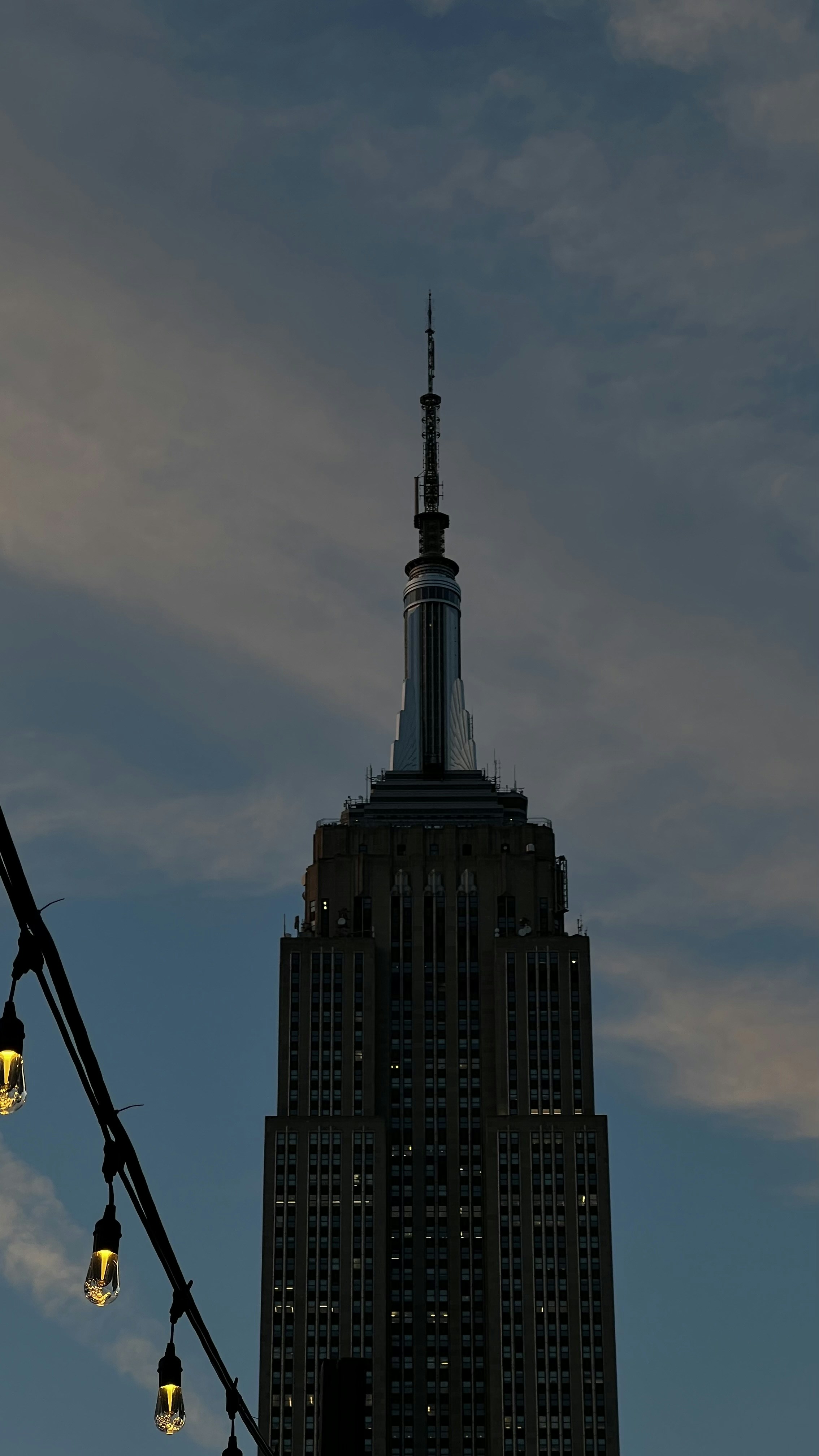 a very tall building with some lights on it