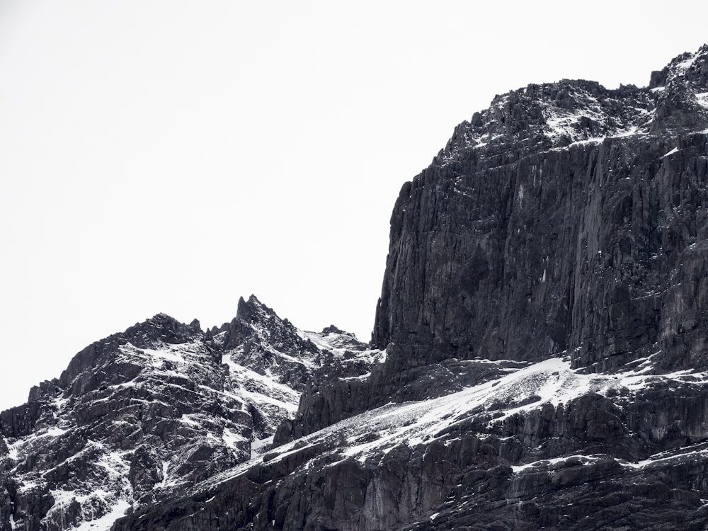 a very tall mountain with some snow on it