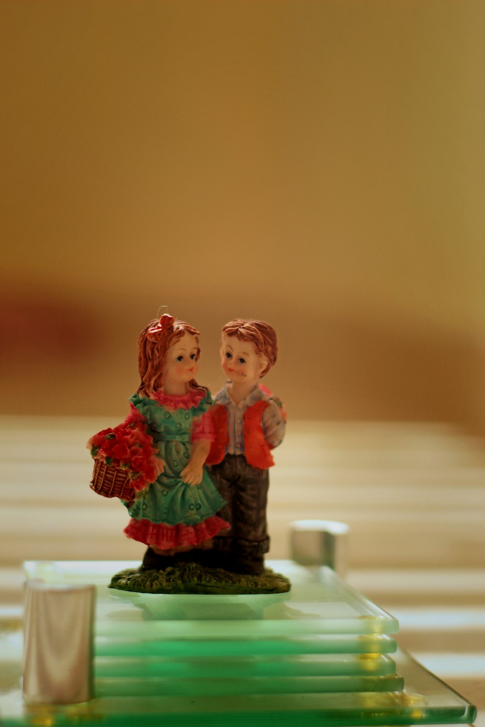 a figurine of a man and a woman on a table