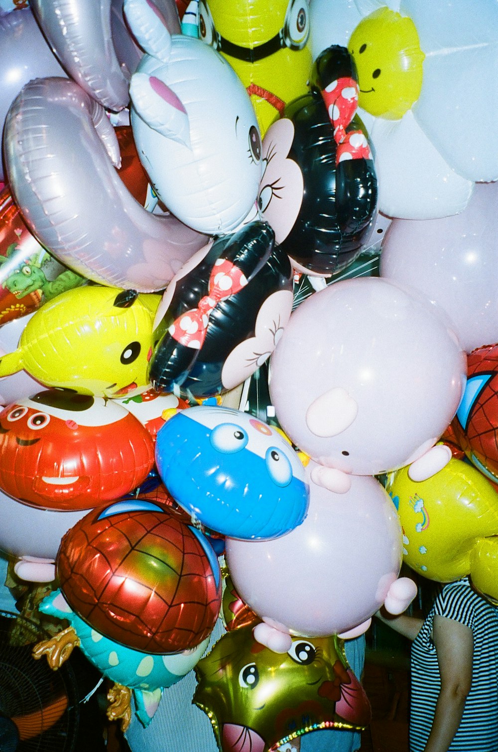 a bunch of balloons that are in the shape of animals