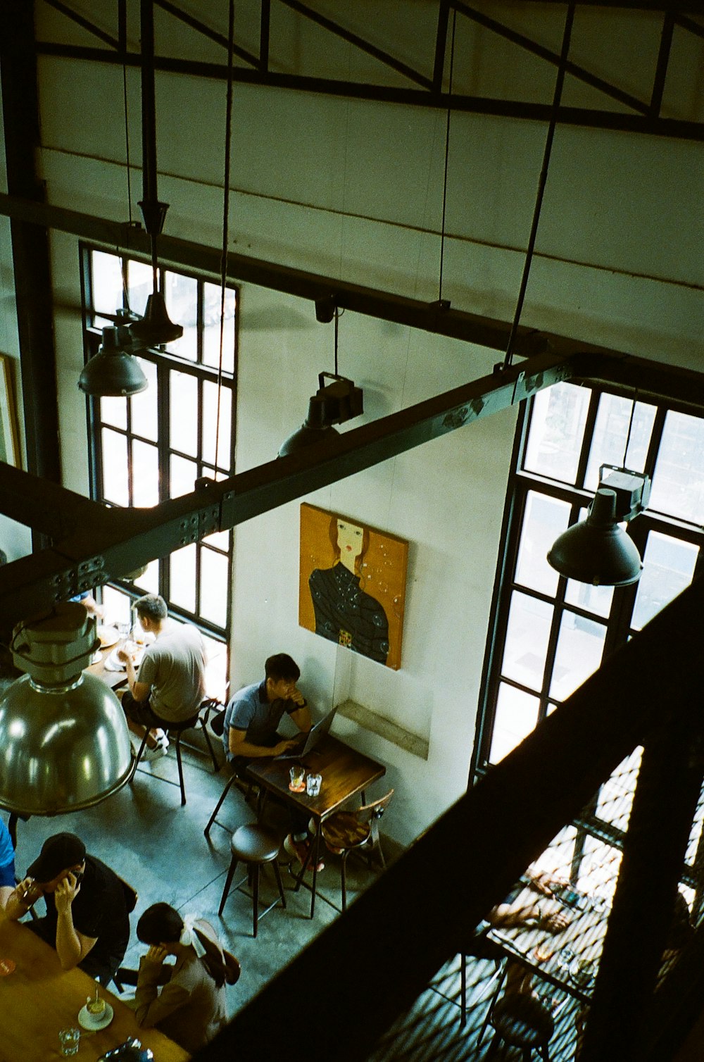 a group of people sitting around a wooden table