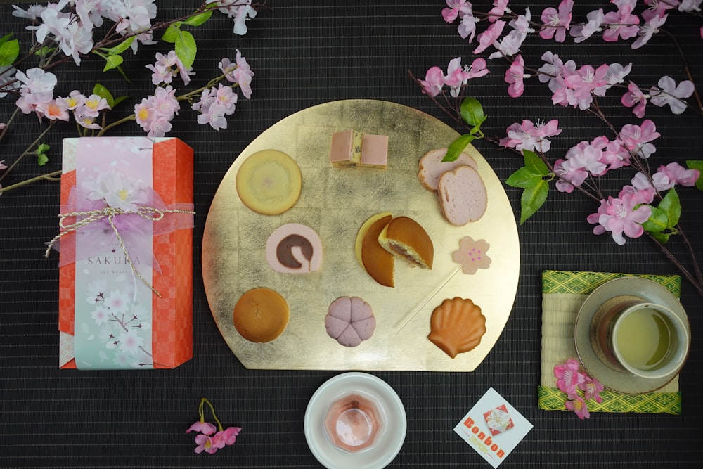 a plate of food and a cup of tea on a table