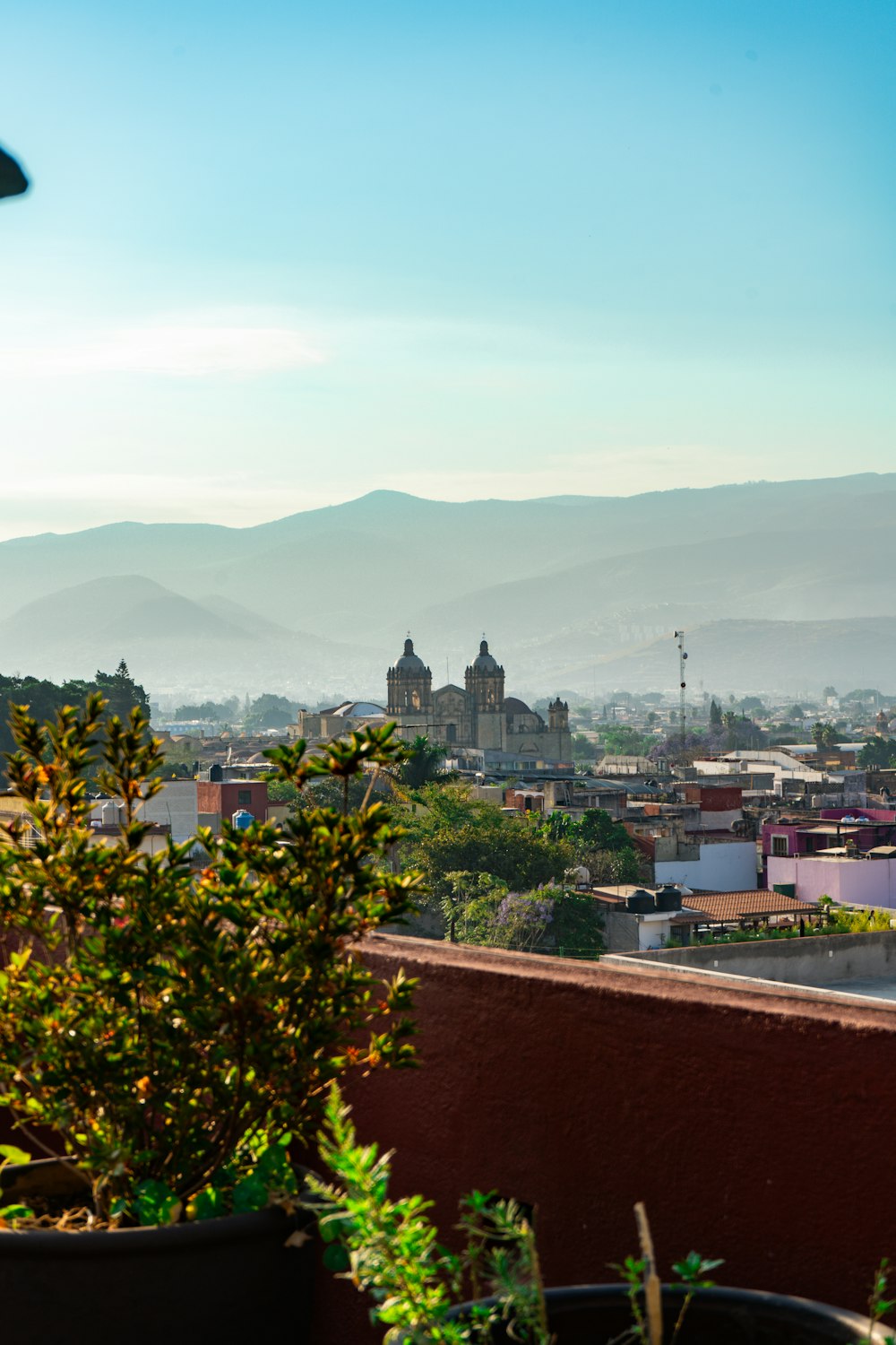 a view of a city with mountains in the background