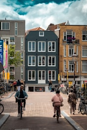 A vibrant city street with cyclists, pedestrians, and eco-friendly public transport.