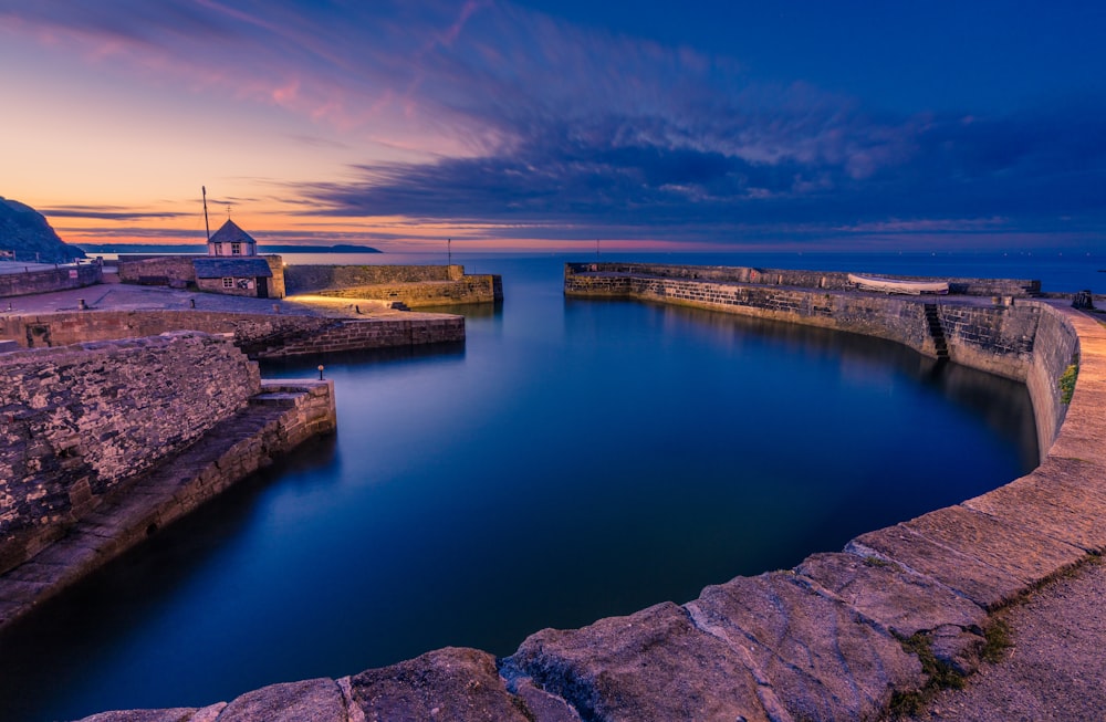 a large body of water surrounded by rocks